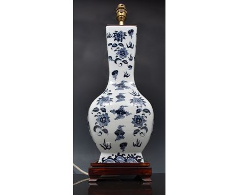 Chinese blue and white porcelain lamp base, square section decorated with dragons, flaming pearls and foliage, 50cm overall.