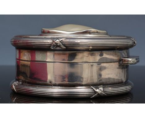 Edwardian circular silver box,Chester 1905, flat lid set with mother of pearl, reeded outlines, diameter 8cm.