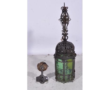 Wrought iron hexagonal lantern, with ornamental scrolled bracket, 72cm overall.

Provenance:  Station Lamp purchased at aucti