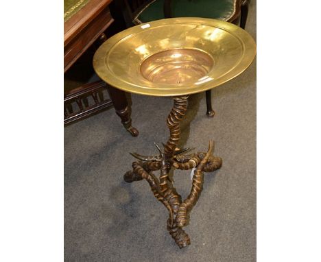 Spittoon, circular pan on a tripod base, height 65cm.