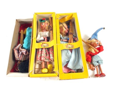A puppet theatre with boxed Pelham puppets including Mitzy, Cinderella, SS Golliwog and an unboxed Noddy