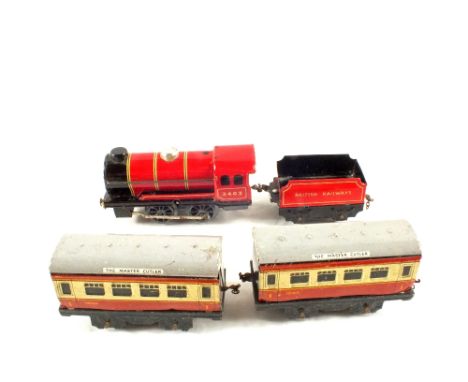 A Chad Valley 0 gauge set (loco, tender and two coaches)