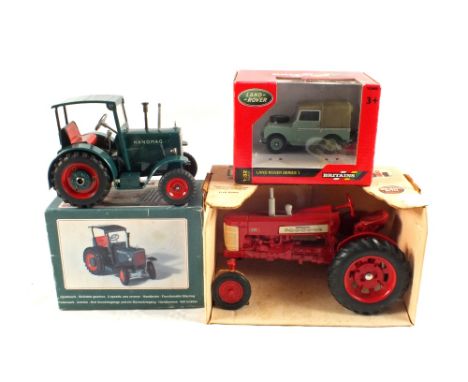 Boxed Britains Farmall 350 tractor, Land Rover series 1 and a Hanomag clockwork tractor