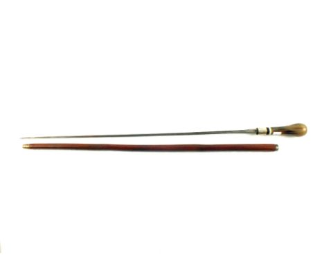 A vintage sword stick with horn and ivory grip