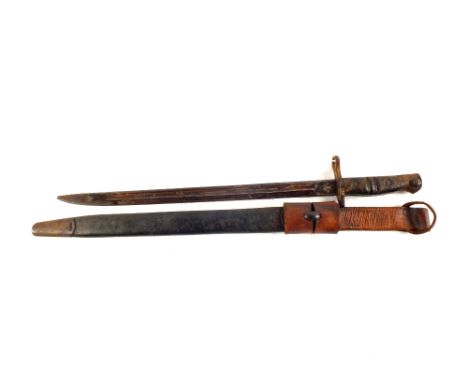 A Remmington model 1913 bayonet marked 12/15 complete with scabbard and leather frog