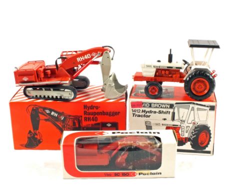 A boxed O&K die cast Hydro-Raupenbagger RH40, a boxed Poclain 1/50 SC150 and a boxed NZG David Brown 1412 Hydra-Shift tractor