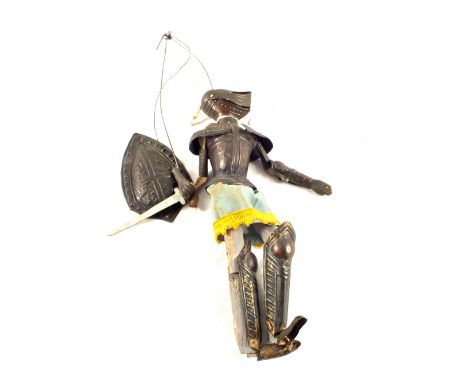 A tin plate Joan of Arc puppet