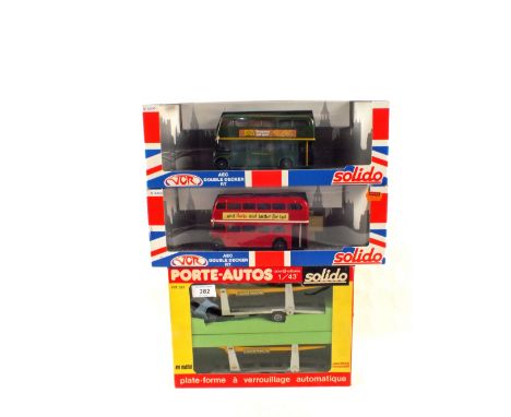 Two boxed Solido AEC Double Decker RT Buses No.4402 and 4404 plus a boxed Solido car transporter with spare trailer Ref 321