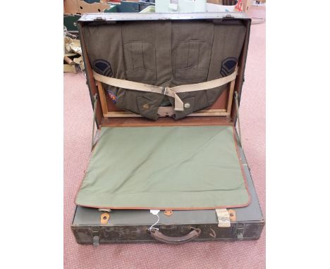 A USA WWII era 'Oshkosh' seapack trunk containing a U.S.A.A.F. 8th Army jacket with insignia, shirt and trousers in top compa