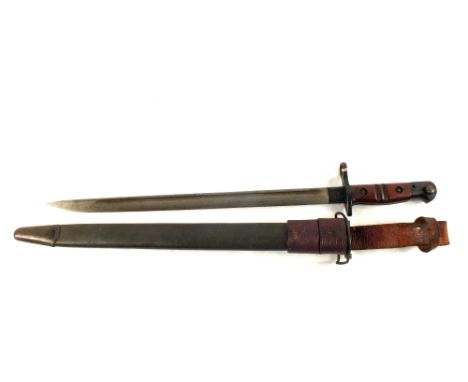 A Remington 1917 model bayonet with 1918 dated scabbard and leather frog
