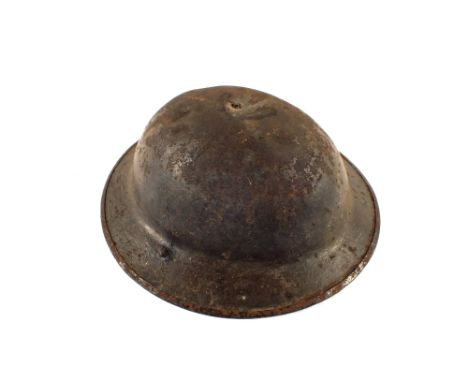 A WWI British Brodie helmet complete with lining