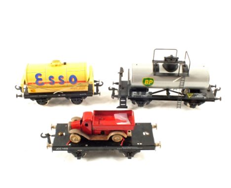 A box with three 0 gauge wagons, one Basset Lowke Esso, one BP tanker and wagon with (old) tin plate lorry