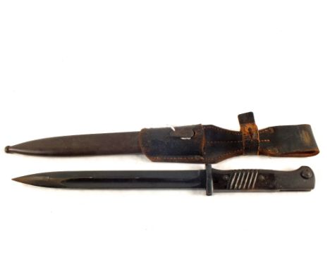 A Third Reich era K.98 bayonet with scabbard and leather frog.  Bayonet and scabbard matching numbers