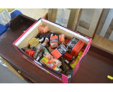 A box of various light bulbs, spark plugs etc.