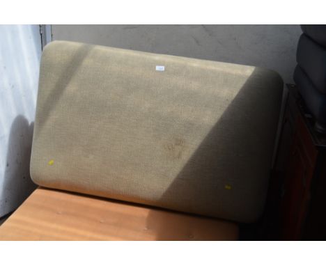 An upholstered foot stool raised on turned legs