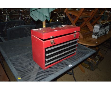 A metal tool box fitted four drawers 