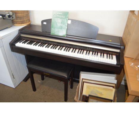 A Yamaha Clavinova keyboard and stool