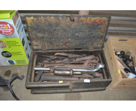 A wooden tool box and contents