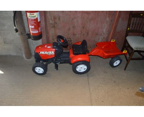 A pedal tractor and trailer 