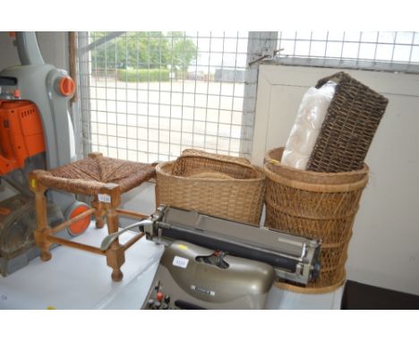 A quantity of wicker baskets and a stool