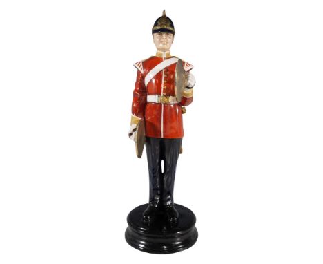 Hand painted figure of a cymbalist in a red and black military uniform. Blue helmet with gilt highlights. Michael Sutty backs