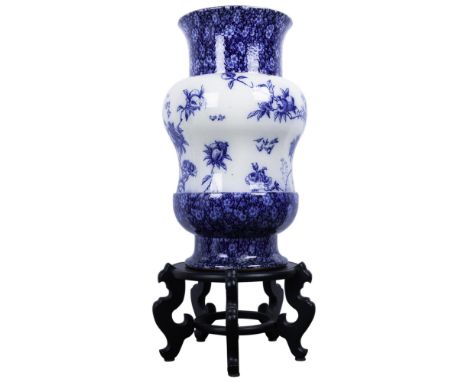A beautiful palatial porcelain hand decorated vessel to hold decorative plants or perhaps to store parasols. White ground gla