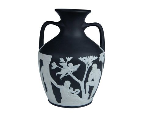 An ebony Jasperware portland vase with applied white biscuit classical reliefs. The scene depicts the myth of Peleus and Thet