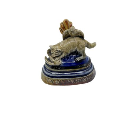 Rare early Doulton Ware place card or menu holder, by George Tinworth. Depicted in a blue and brown glaze. a feline attacking