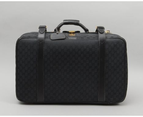 Gucci, valise rigide toile au monogramme et cuir noir avec ses clés. Référence:La vente de cet objet est au profit de la Fond