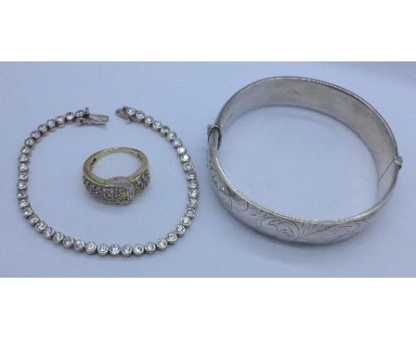 A silver bangle, a silver bracelet and a silver and tanzanite ring, Q