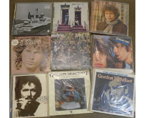 Twenty-six 1960's and 1970's LP records, including Rolling Stones, Gordon Lightfoot, Bob Dylan, Leonard Cohen, Eric Clapton, 