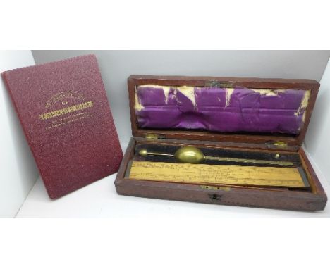 A Guide to Farmar's Rule book with a cased hydrometer and boxwood slide rule