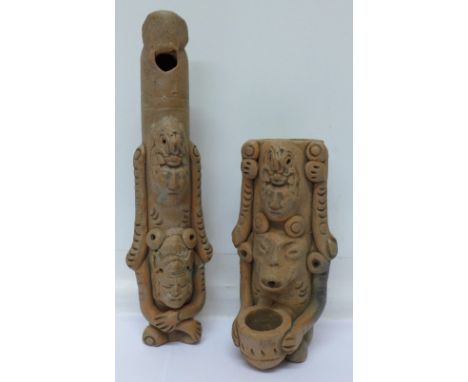 A pre Colombian terracotta flute and one other similar item