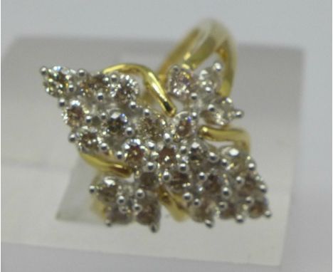 An 18ct gold cluster ring with twenty-five brilliant cut diamonds, shank marked 1ct, 5.7g, M