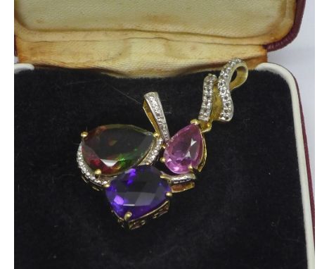 A silver gilt and amethyst pendant and two silver gilt and quartz pendants