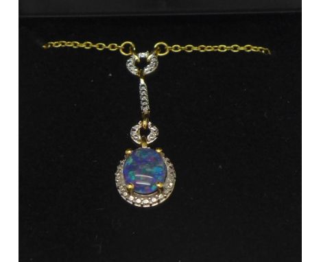 A silver gilt pendant set with boulder opal triplet