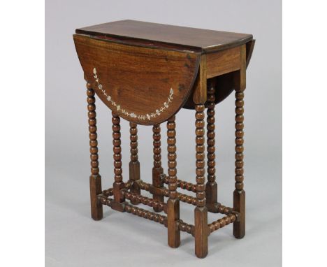 A 20th century mahogany drop-leaf occasional table with foliate mother-of-pearl inlay to the rounded drop leaves, on bobbin-t