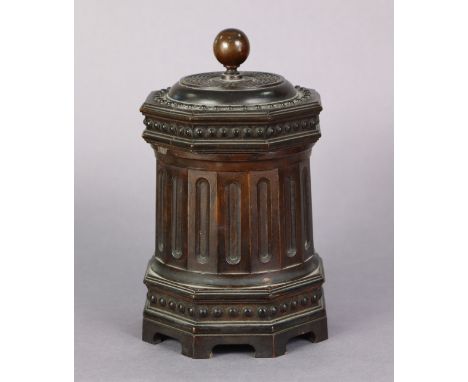 A 19th century fruitwood rotunda-form tea caddy, with carved decoration to the removable cover &amp; octagonal plinth base, f