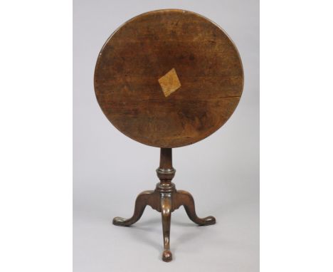 A late 18th century oak tripod table with oval tilt-top, inlaid with a light-oak lozenge patch-repair &amp; stamped with init