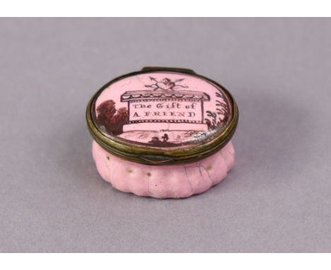 A late 18th century English enamel pink-ground oval patch box inscribed “The Gift of A Friend” on monument to the hinged lid,