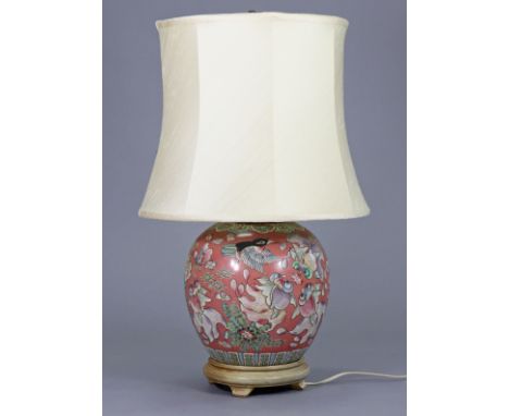 A Chinese porcelain pink-ground ginger jar/table lamp with decoration of swimming fish, 26” high over-all.