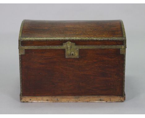 A Victorian mahogany &amp; brass-bound domed-top travelling trunk, with brass lock &amp; side handles, &amp; fabric-lined int