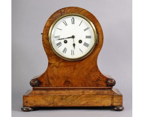 A Victorian burr-walnut mantel clock in balloon-shaped case with applied foliate roundels, on plinth base with ebonised bun f