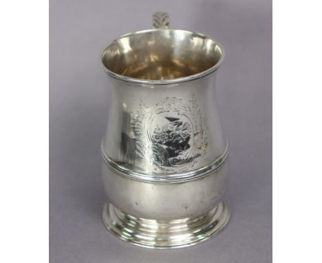 A George II silver baluster mug with reeded band to the lower part, acanthus scroll handle, engraved cartouche with initials 