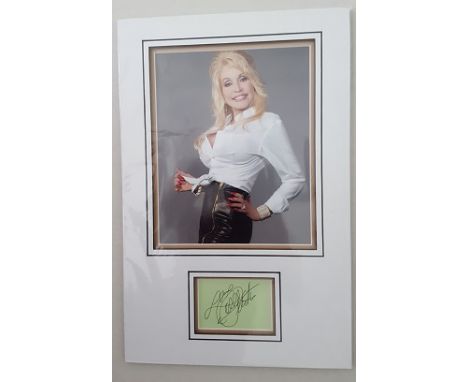 Dolly Parton signed presentation.  20cm x 25cm, 10 x 8 inches image double 3D mounted in acid free mountboard with an authent