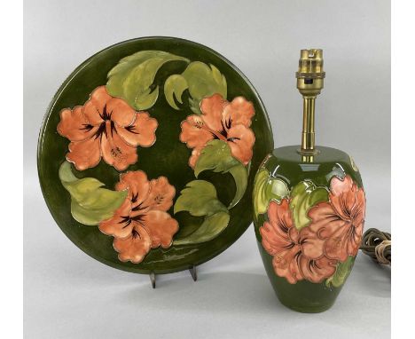 MOORCROFT POTTERY 'HIBISCUS' PATTERN ITEMS comprising table lamp, 30cms high, and platter, paper sticker to base, 31cms diame