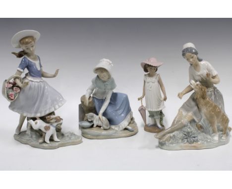 Three Nao figures of girls with animals, together with a Nao girl with umbrella, tallest 26cm (4)