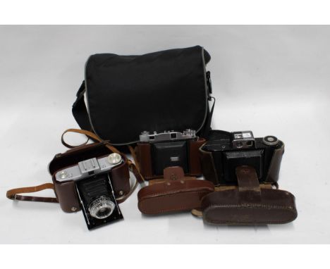 Three vintage folding cameras to include Zeiss in a camera bag (3)