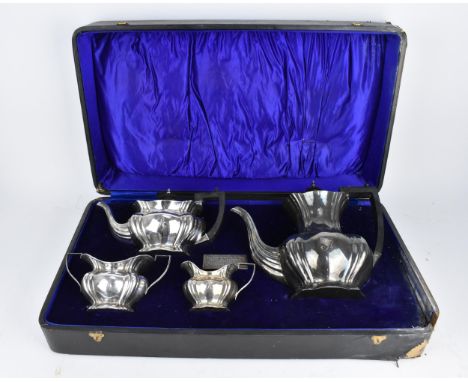 A boxed Edwardian four piece silver tea/coffee set by Marks &amp; Cohen, Birmingham 1907, comprising a teapot, coffee pot, mi