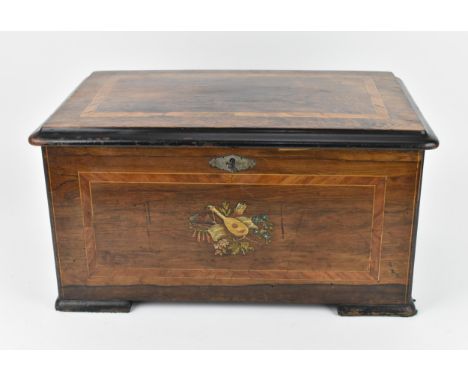 A late 19th century inlaid cylinder music box, with three bells and brass cylinder with graduated comb, the rosewood lid and 